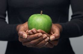 Christian Nutrition - Woman holding an Apple