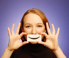 Controlling Emotions-Woman holding paper smile
