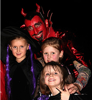 Christian Halloween Activities father dressud up as Satan with children
