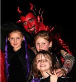 Christian Halloween Activities father dressud up as Satan with children