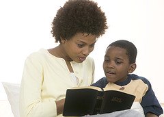 Family time Bible Studies - Mother reading Bible to son