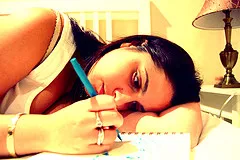 woman writing in Christian prayer journal